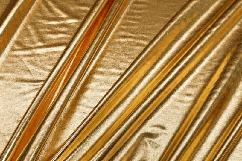 Tessuto lycra metallizzata elastica di colore oro brillante a metraggio.