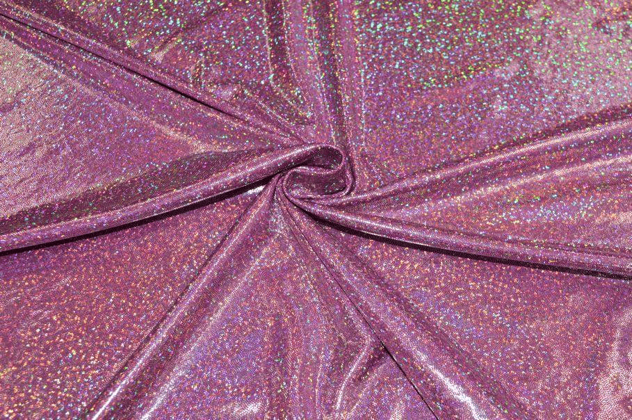 Tessuto in lycra lurex glitterata colore fucsia brillante con riflessi olografici.