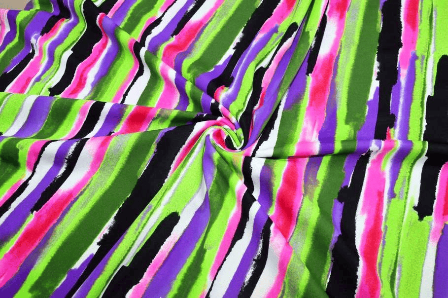 Tessuto lycra stampata fantasia a strisce multicolor effetto pennellata.